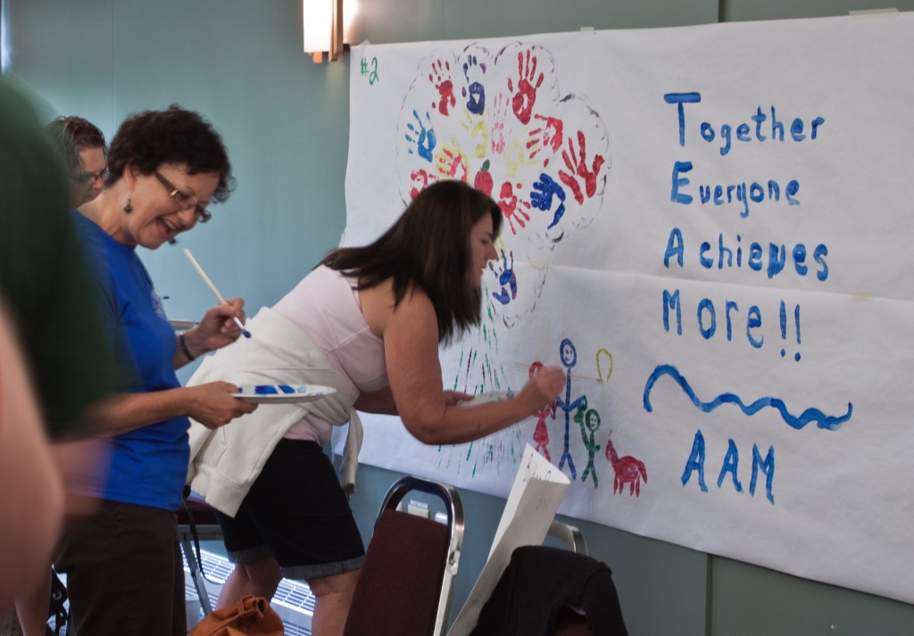 Terry Gillis painting with a smile at the 2011 Family Gathering.