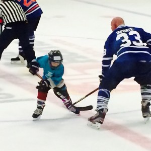 NHL player Al Iafrate playing hockey with very young hockey player