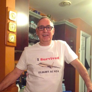 Wayne in his new T-shirt that reads "I survived flight AC 624"