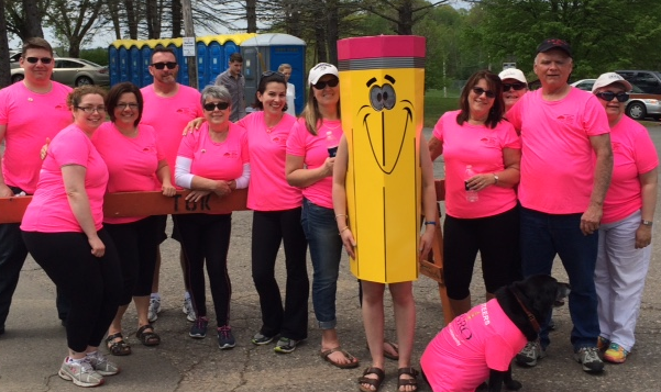 The Blossom Crew stand with mascot