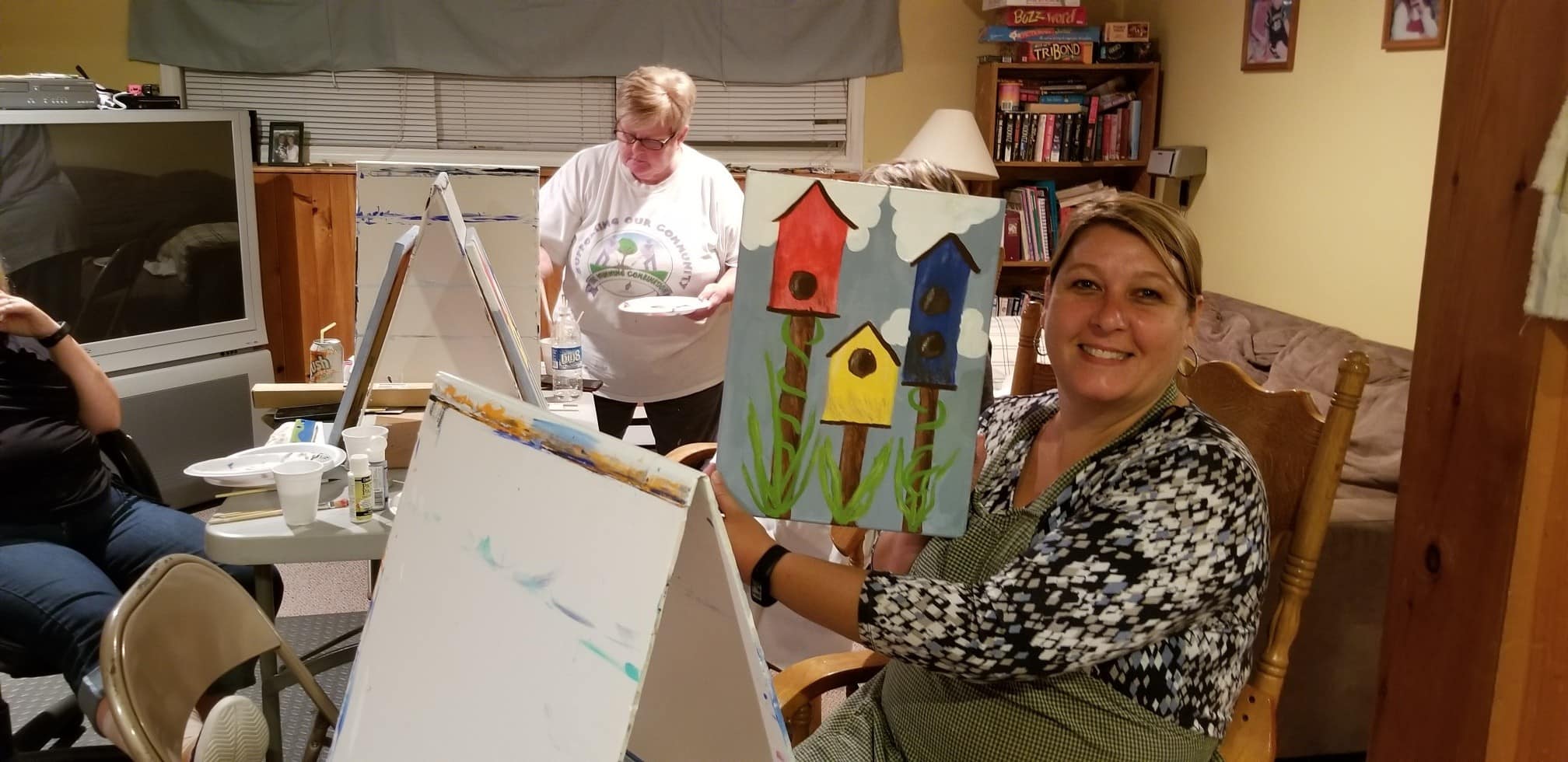 Tanya Young shows her painting at a paint night in New Glasgow
