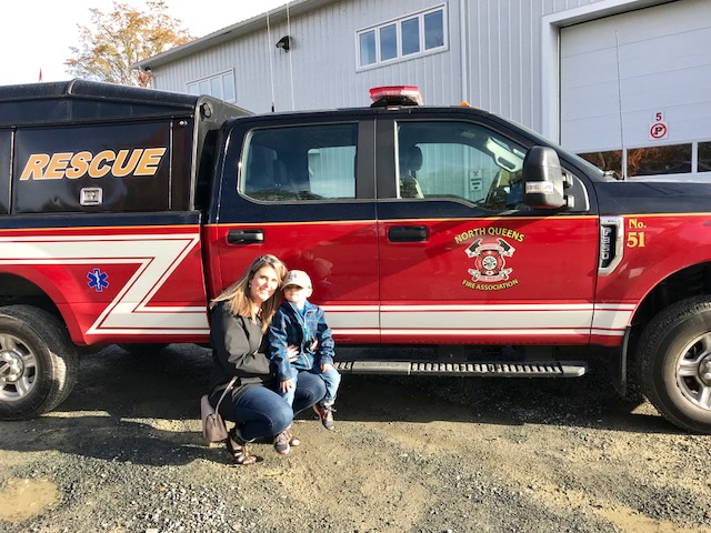 Mother and son with a rescue truck